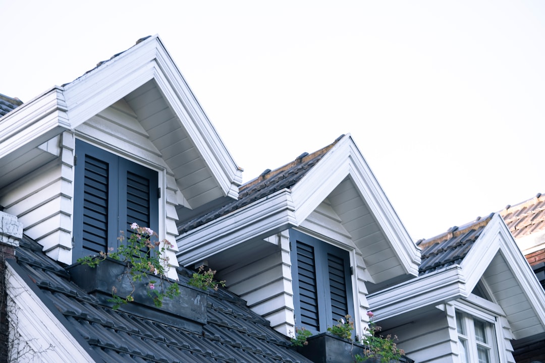 Close-up detail of professional roof repair work showing quality materials and expert technique with proper shingle placement